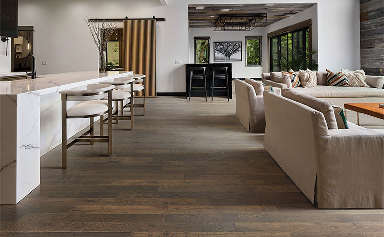 wood flooring in open concept kitchen and living room