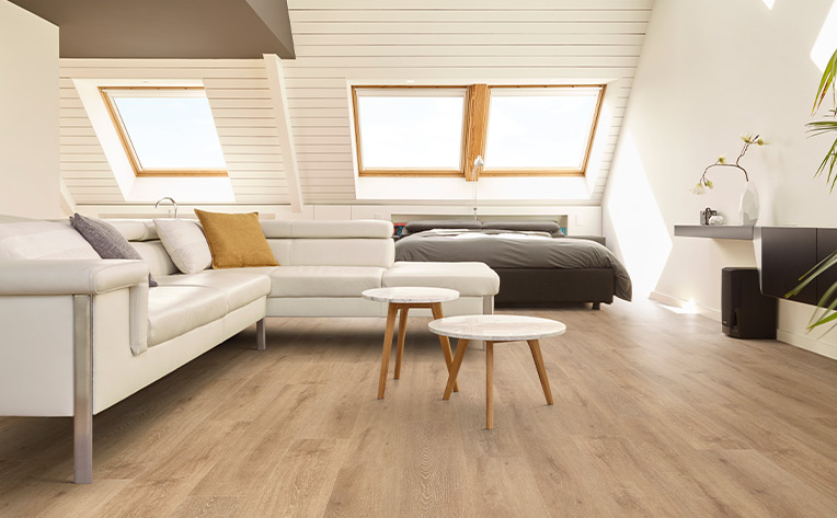 wood look vinyl in house with white walls and white couch
